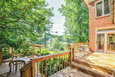Multi-level deck offers the opportunity to relax in the hot tub while you gaze upon the amazing lake views