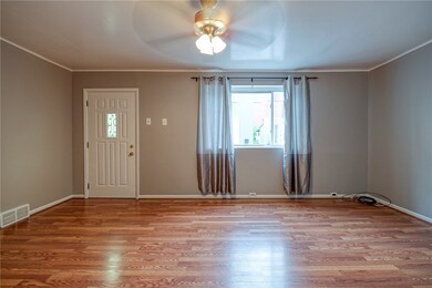 LIVINGROOM FACING THE FRONT OF THE HOUSE APPROX. 18'X14'