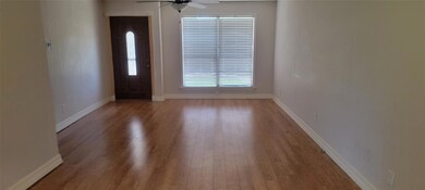 Entryway featuring wood-type flooring and ceiling 