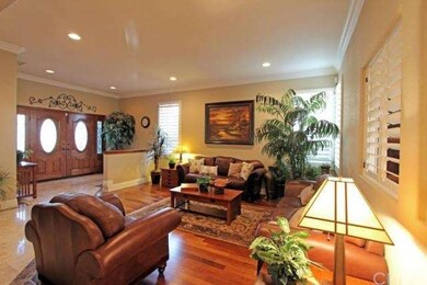 Large Formal Living area has Batula Walnut wood fl