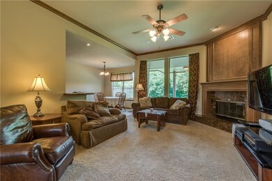 Large paneless windows overlooking wooded creek lo