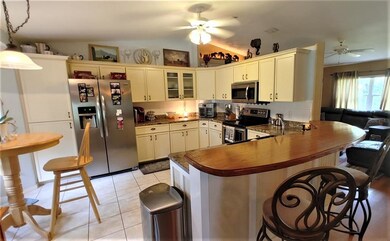 Stainless steel appliances with hand crafted wood 