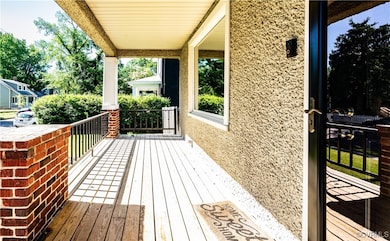 Wooden deck featuring covered porch
