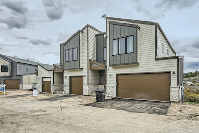 View of front of house with board and batten sidin