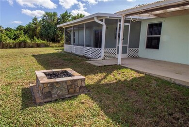 Firepit, covered patio and a screened porch