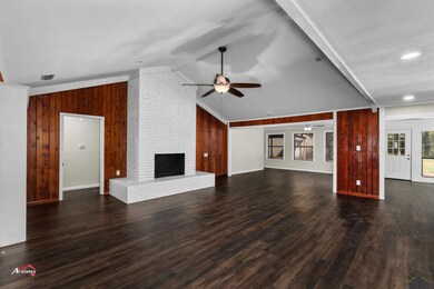 Unfurnished living room with lofted ceiling, dark 
