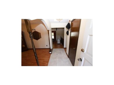 The Entry leads to open Dining Room to the left, c