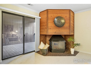 Living Room fireplace and Sliding Glass Door out to Covered Deck