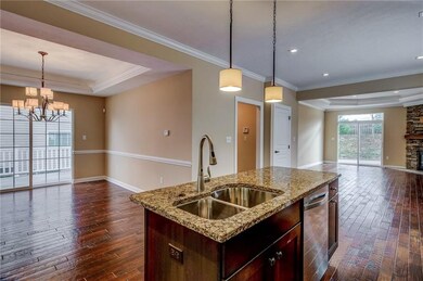 Crown molding, tray ceilings, bronze fixtures, and