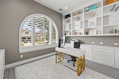 Office area featuring light wood-style floors and