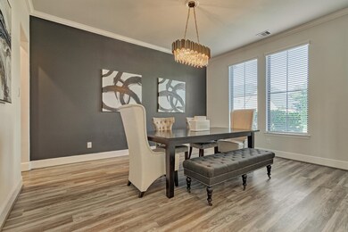 Formal dining room featuring an elegant chandelier