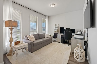 Living area featuring an office area and wood fini