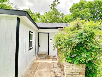 Property entrance with a shingled roof
