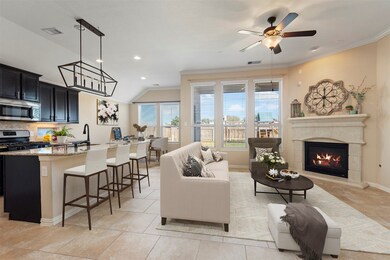 The living area (virtually staged here) is elegant, warm and the heart of the home.  The large windows offer a lovely view of the backyard from the living area and kitchen.