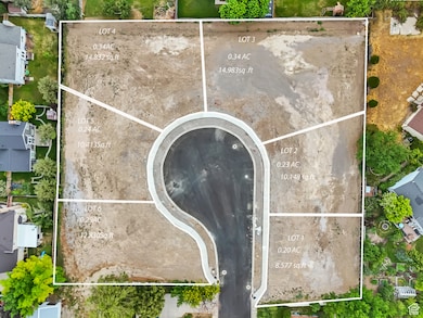 Aerial view of property and surrounding area with property parcel outlined