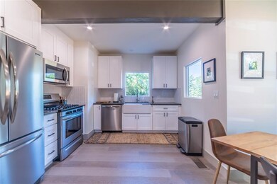 Kitchen featuring decorative backsplash, a sink, 