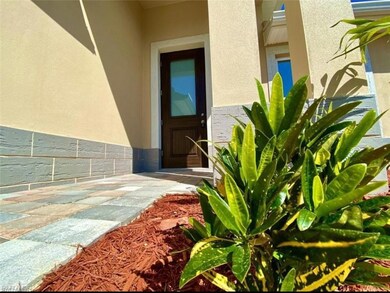 View of exterior entry featuring stucco siding