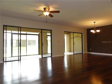 Rich wood floors adorn the floors of the dining ro