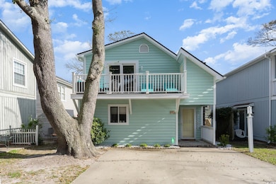 View of front of house with a balcony
