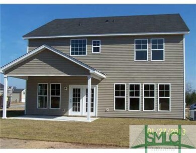 Exterior Back. Beautiful large covered porch out b