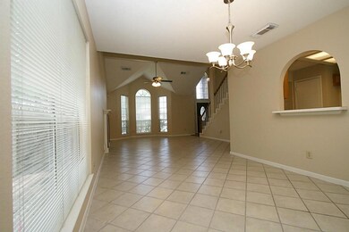 Formal Dining and Family Room, arched window and counter keeps the Kitchen connected:)