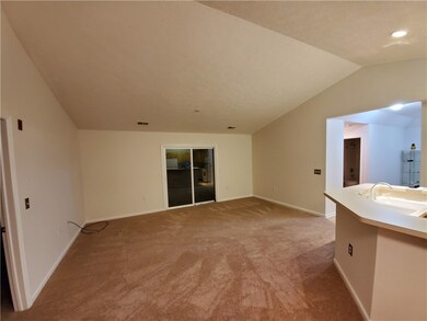 Living Room open to Dining Room/Kitchen, with cath