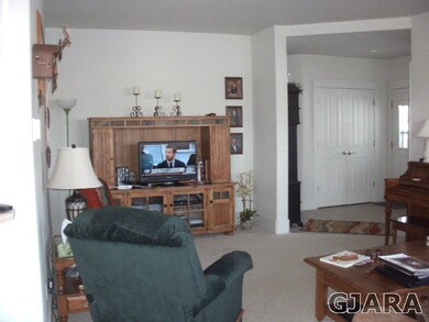 Looking at Living from Dining towards Entry Way