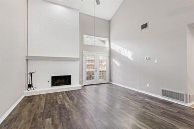 Unfurnished living room with ceiling fan, french d