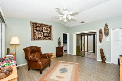 The living room has attractive laminate flooring w