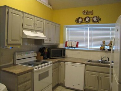 Cute Kitchen with painted cabinets & tile floor