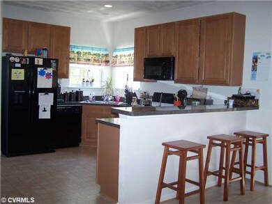 Kitchen - equipped with appliances, breakfast bar