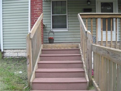 Newer steps lead to the front porch and door!