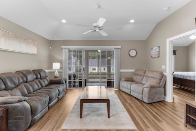 Living room featuring light hardwood / wood-style 
