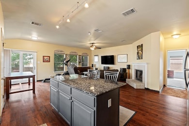Kitchen with a center island, gray cabinetry, a c