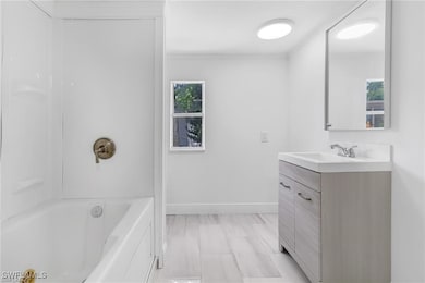 Full bathroom with vanity and  shower combination