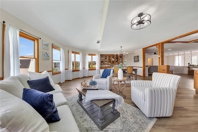 Beautiful hardwood flooring seamlessly connects th