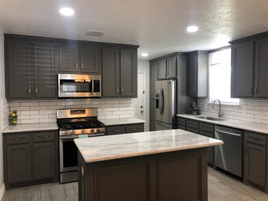 UPDATE KITCHEN WITH SHAKER STYLE CABINETS, QUARTZ COUNTER TOPS ACCENTED WITH SUBWAY TILES