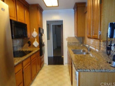 Granite counter and designer tile backsplash, slee