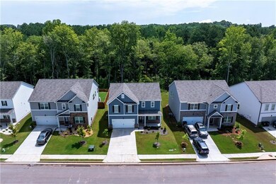 Aerial perspective of suburban area featuring a forest