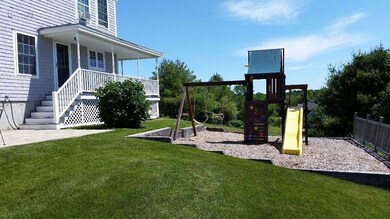 Rear yard with built in play set and...