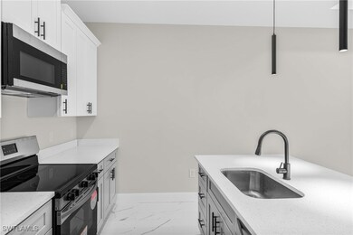 Kitchen featuring appliances with stainless steel