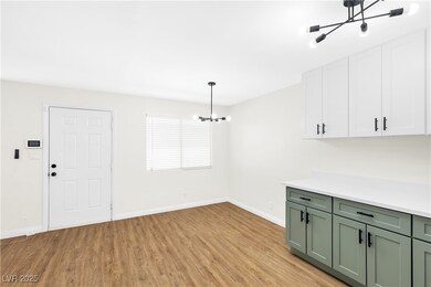Unfurnished dining area with a chandelier, light w