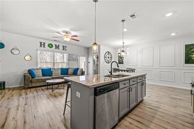 Kitchen with visible vents, stainless steel dishwa