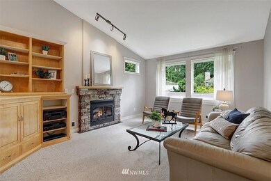 Front room with a gas fireplace and stunning built in shelves