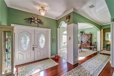 FOYER INCLUDING CHERRY WOOD FLOORING, CROWN MOULDI