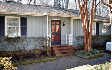 Guests enter through the front brick-paver court yard