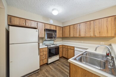 The kitchen offers lots of storage and comes equip