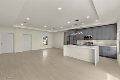 Kitchen with sink, appliances with stainless steel