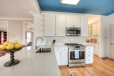 Enjoy your updated kitchen with quartz, white cabi