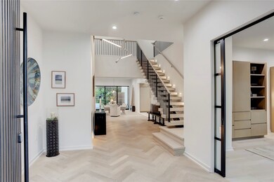 Soaring entrance hall and stunning floating stairc